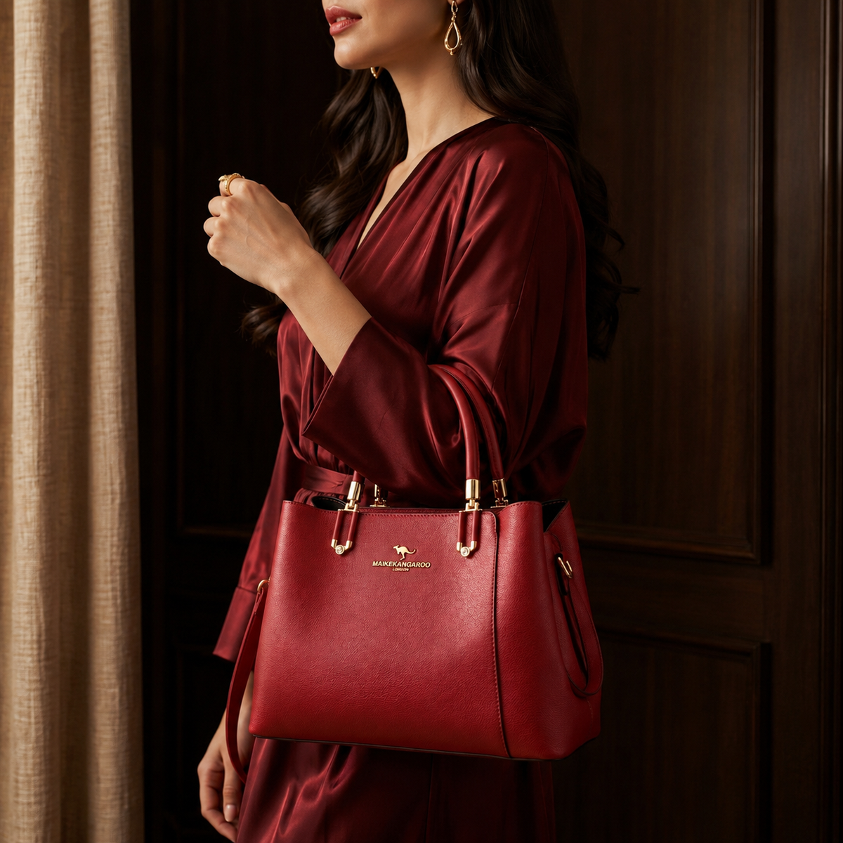 Woman holding a red handbag with a visible brand logo, wearing a matching red outfit.